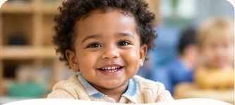Happy two-year-old in a welcoming classroom environment