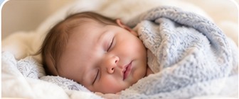 Infant resting peacefully in a warm, nurturing setting